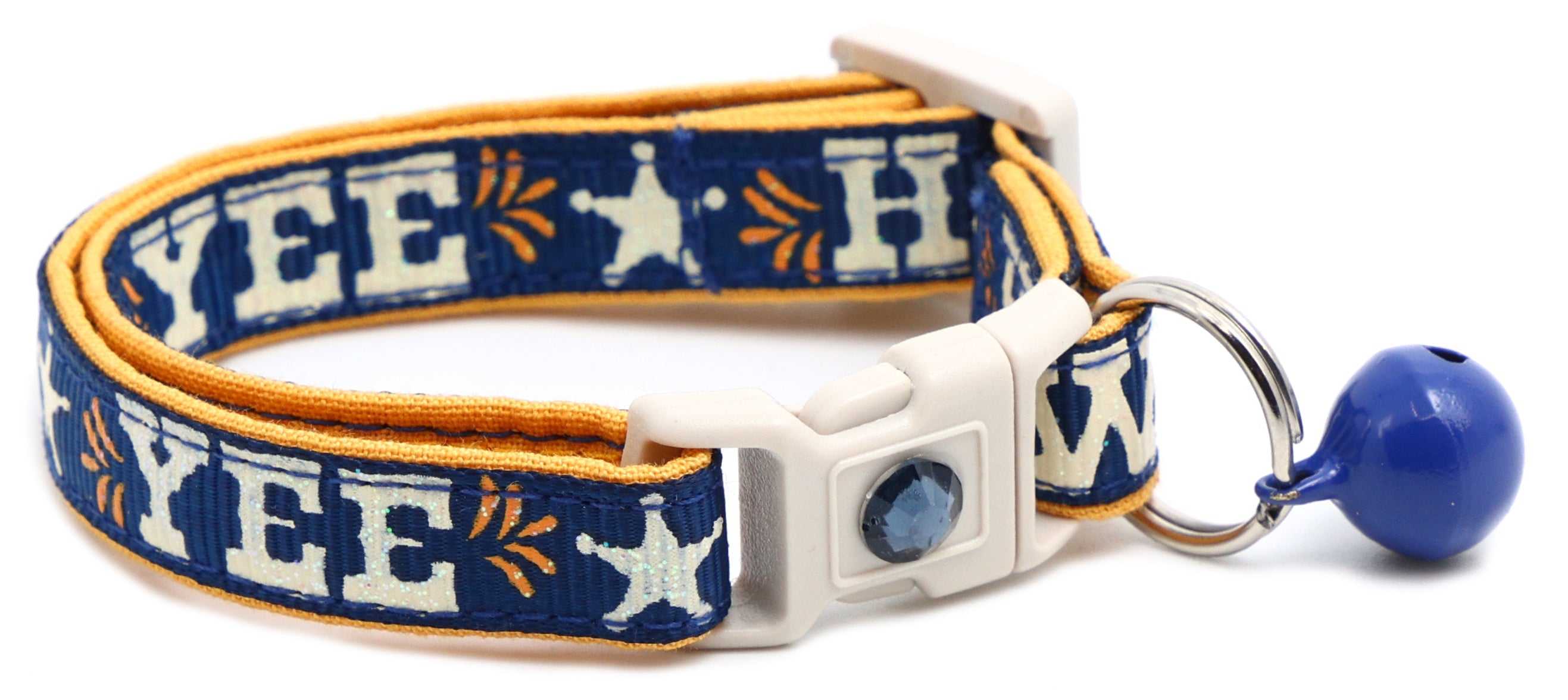 Navy breakaway pet collar with light-blue gem buckle, orange trim, blue jingle bell