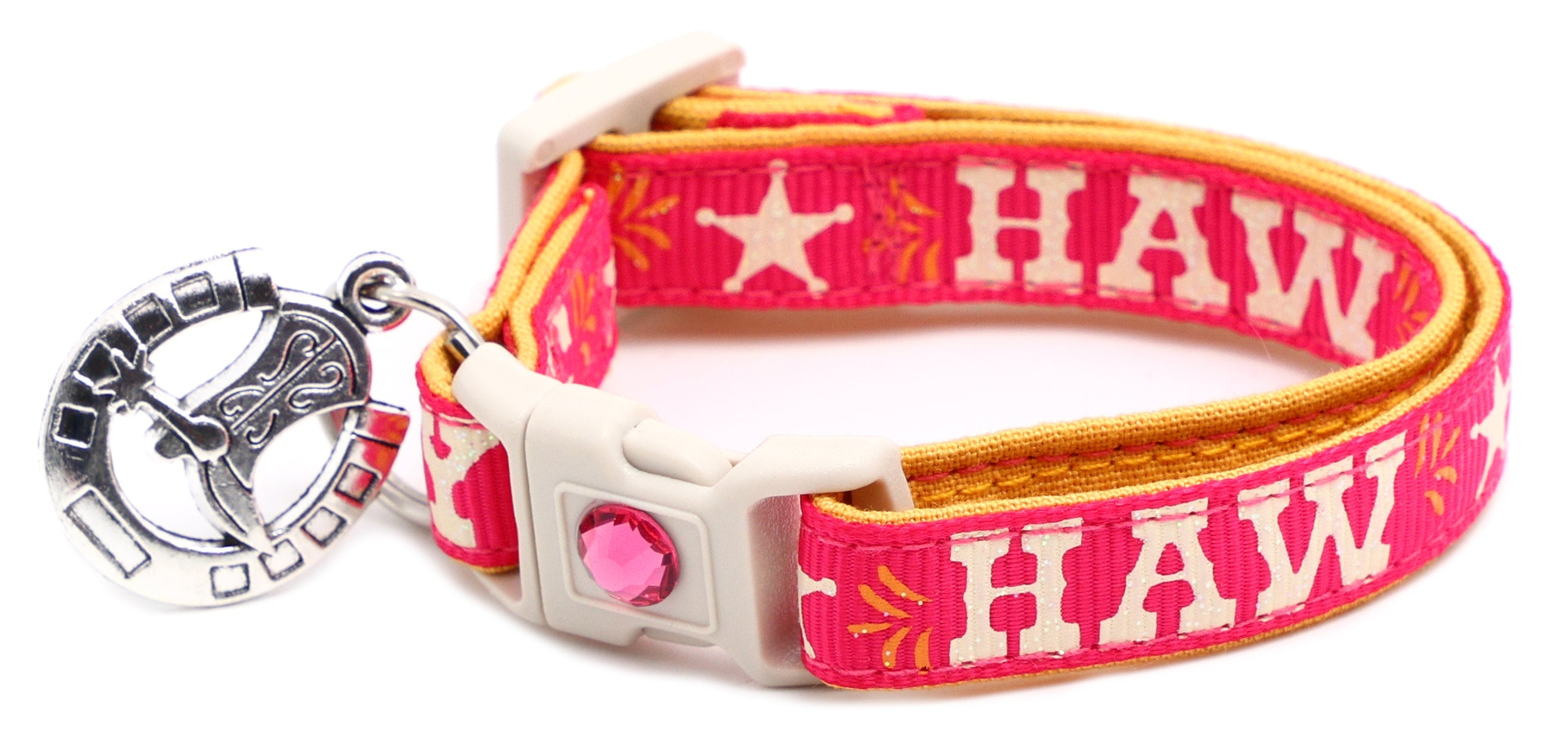 Hot pink breakaway pet collar with star “YEE HAW” print, white buckle, horseshoe charm
