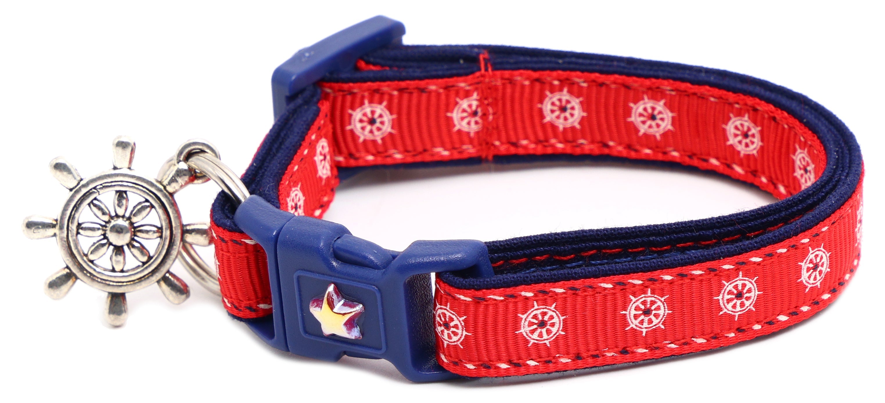 Red cat breakaway collar with navy buckle and ship wheel charm