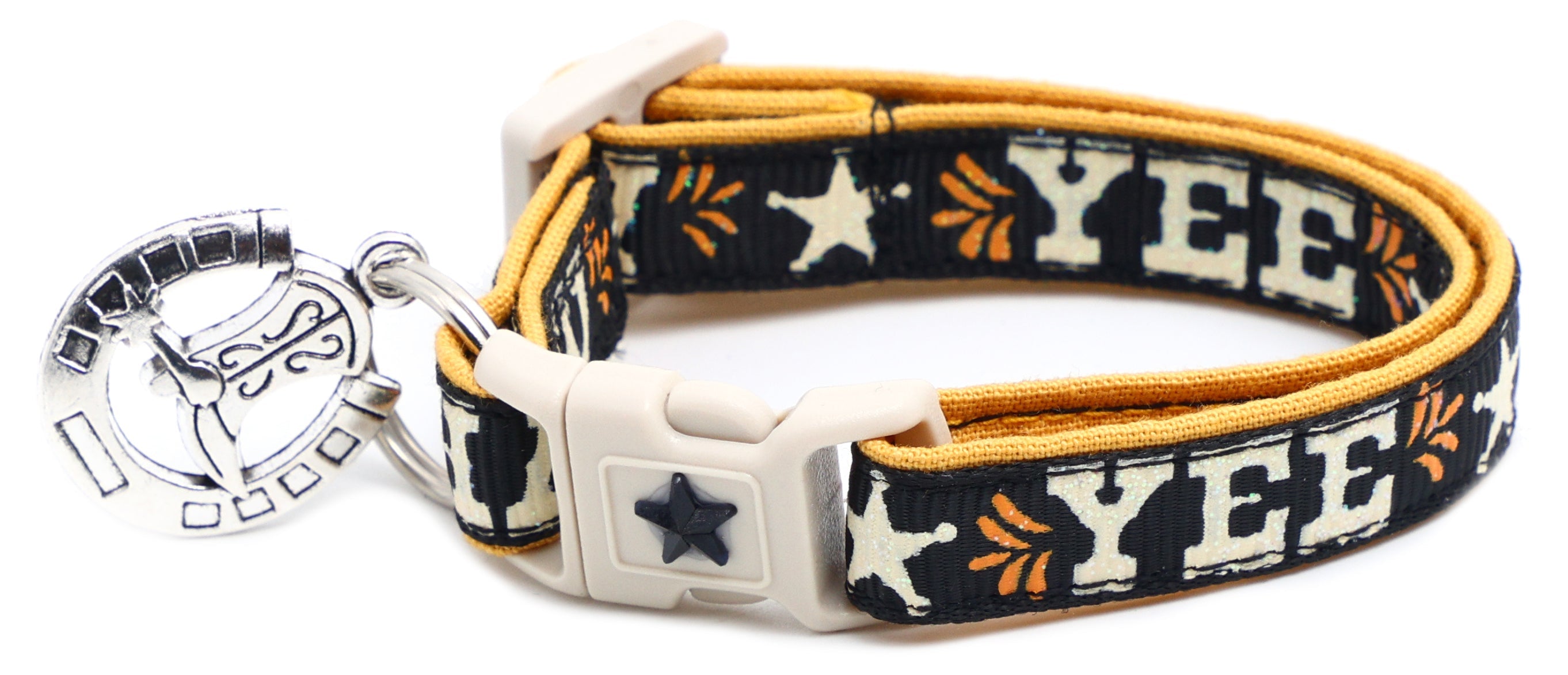 Dark navy breakaway pet collar with gold trim, white buckle, “YEE” star pattern