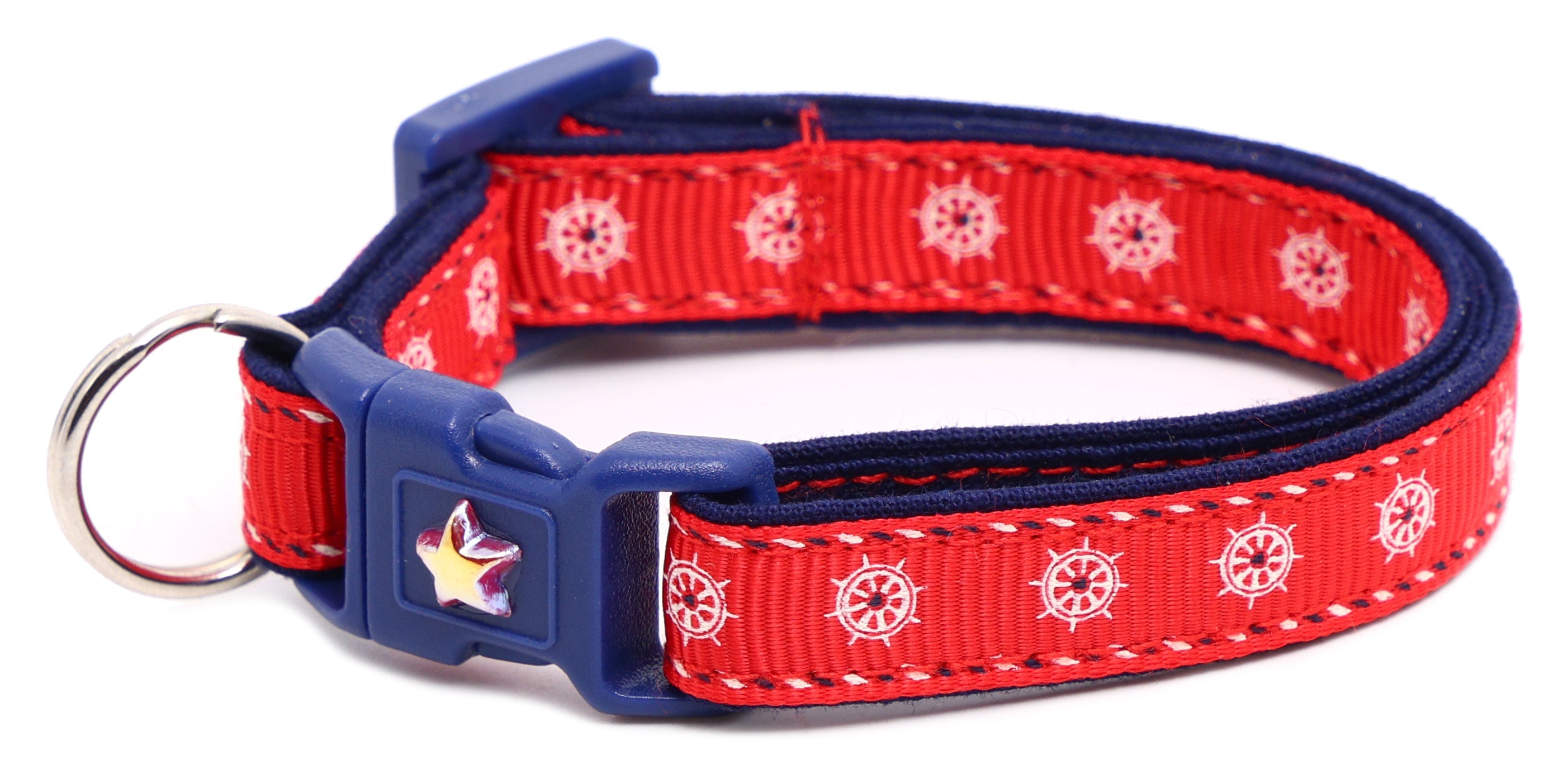 Red ships wheel breakaway cat collar with navy trim; star badge buckle and D-ring.