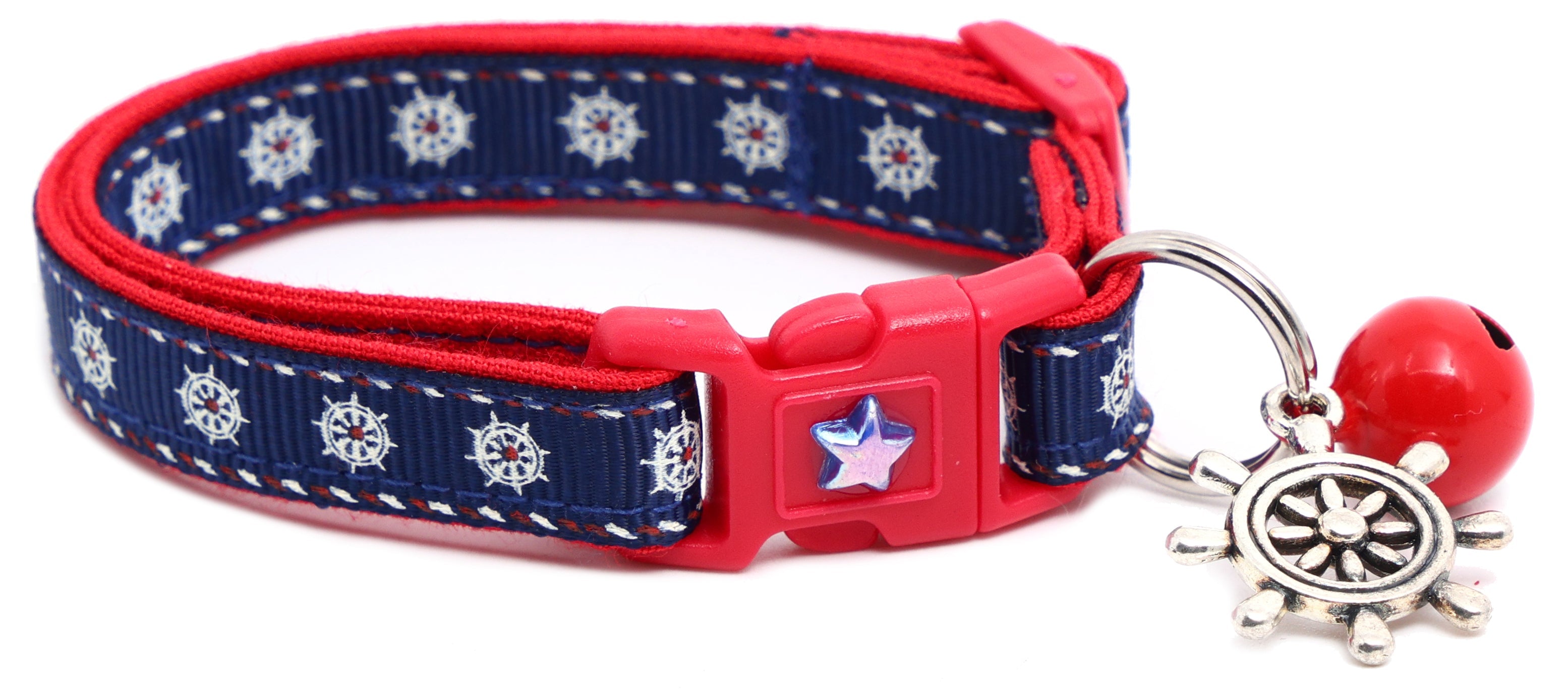 Navy cat breakaway collar with red trim, star charm, and ship wheel bell