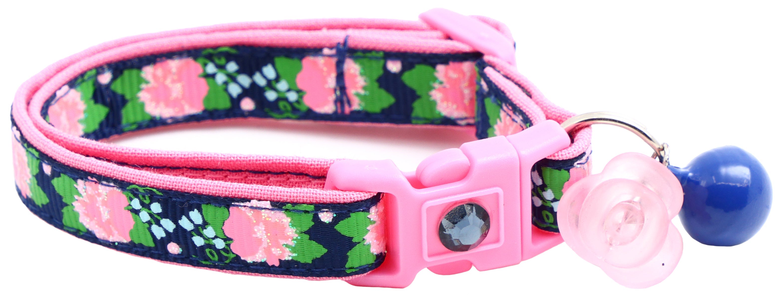 Navy floral cat collar with pink buckle, metal ring, pink flower charm and blue bell