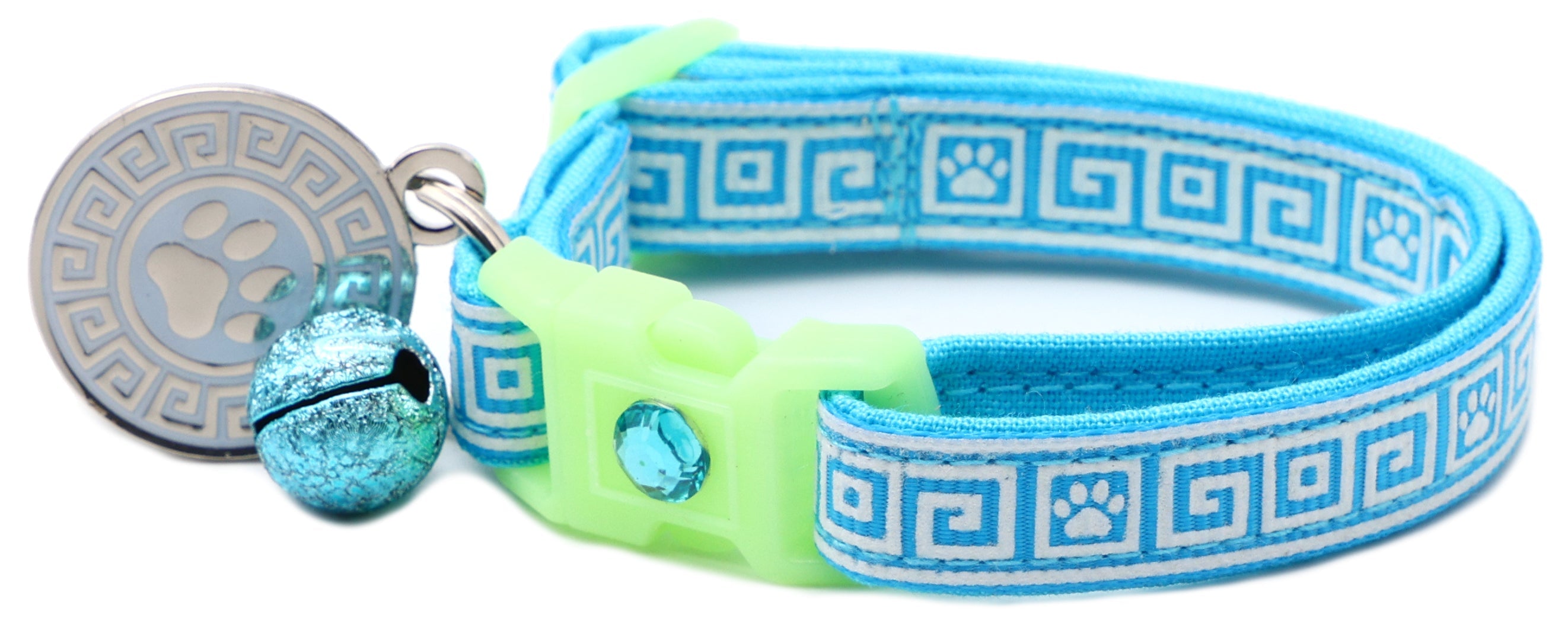 Light blue patterned cat collar with lime breakaway insert, silver paw tag, and blue bell