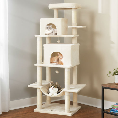 Cream cat tree tower with stacked condos and a top perch with resting cats