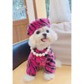 Pet faux fur coat with matching zebra-print hat and pearl collar, hot pink