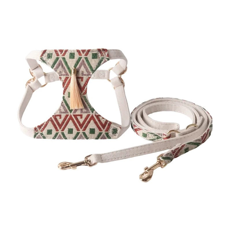Beige tribal dog harness with tassel and adjustable straps, matching leash with clips