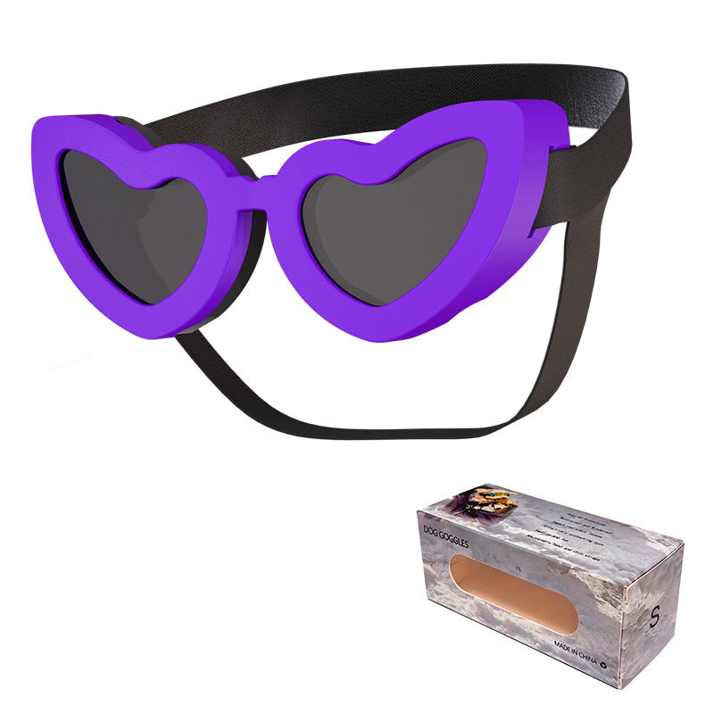Purple heart-shaped pet sunglasses with black adjustable strap and dark lenses