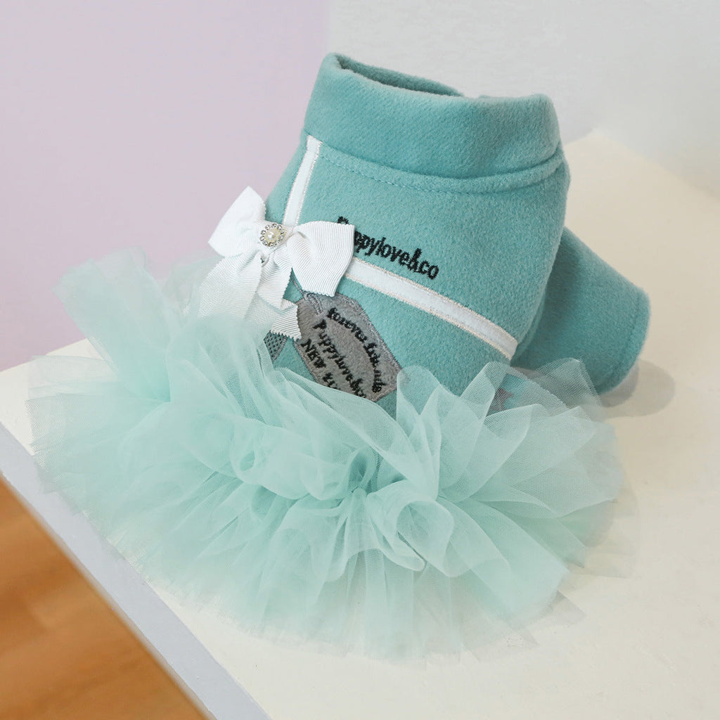 Teal turtleneck-style dog dress with mint tulle ruffles and white bow ribbon