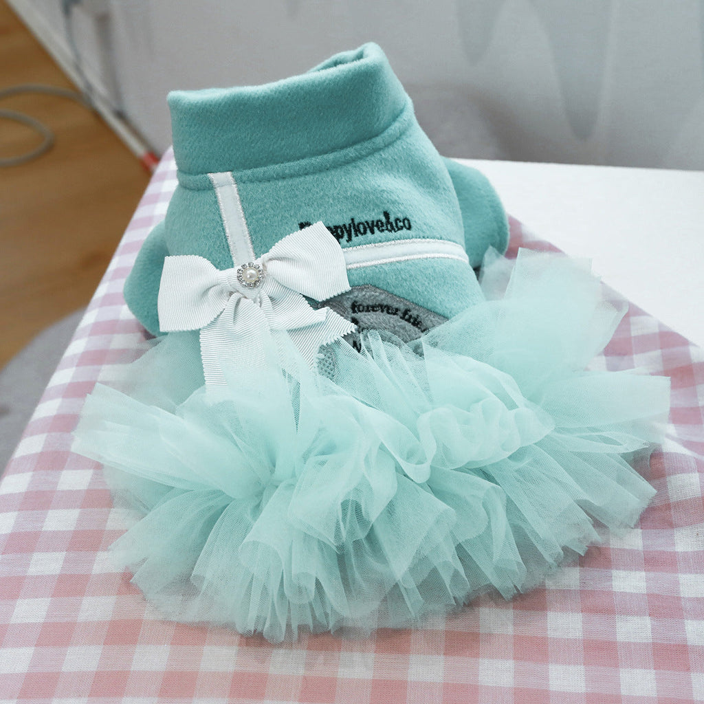 Teal dog tutu dress with layered mint tulle skirt and white bow at the chest