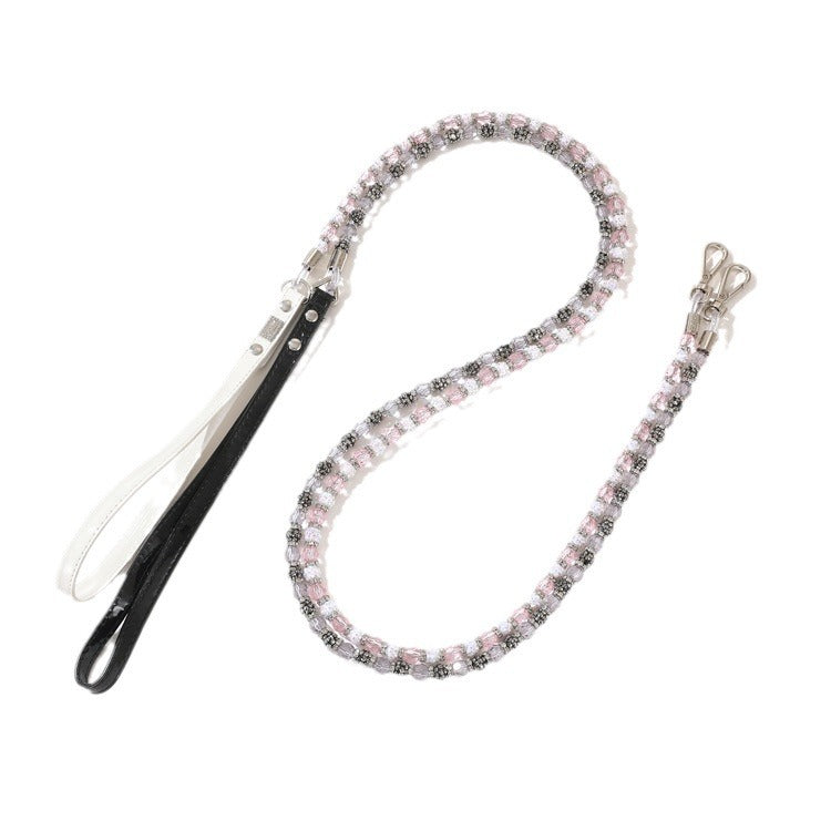 Pink crystal beaded pet leash with black handle strap and metal clips