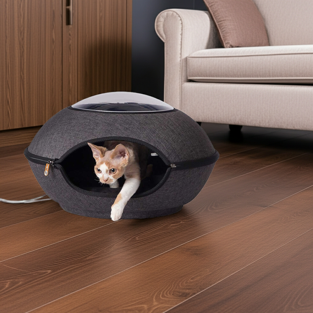 Grey heated cat cave bed with tunnel opening, cat resting inside