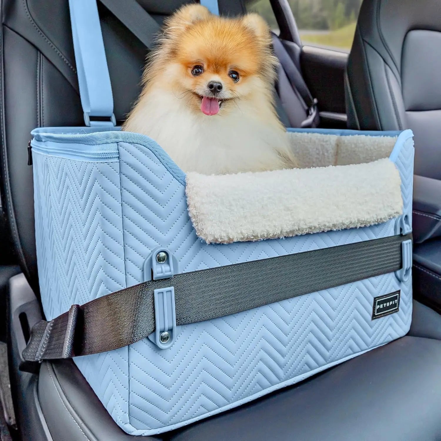 Light blue foldable pet booster car seat with safety buckles and tether strap, plush lining