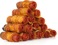 Stack of rolled dog treats with amber color and red spiral centers