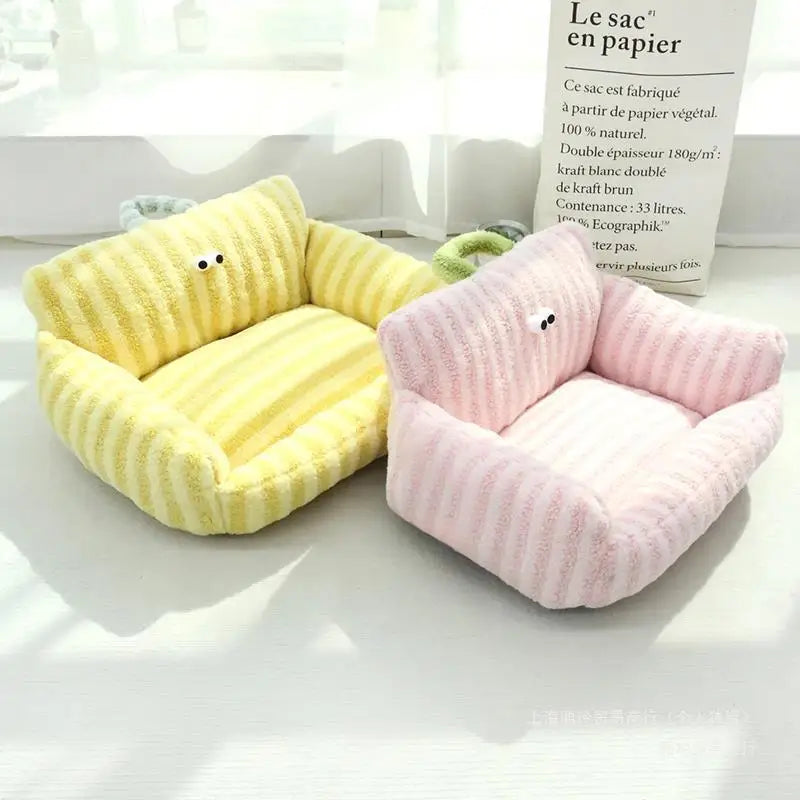 Plush pet sofa beds in yellow and pink corduroy, each with cartoon face
