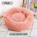 Pink round donut pet bed plush nest, shaggy long-pile fabric and hollow center