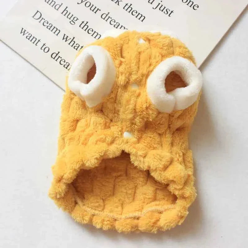 Yellow plush cat sweater vest with bear-face chest patch and paw-shaped textured knit