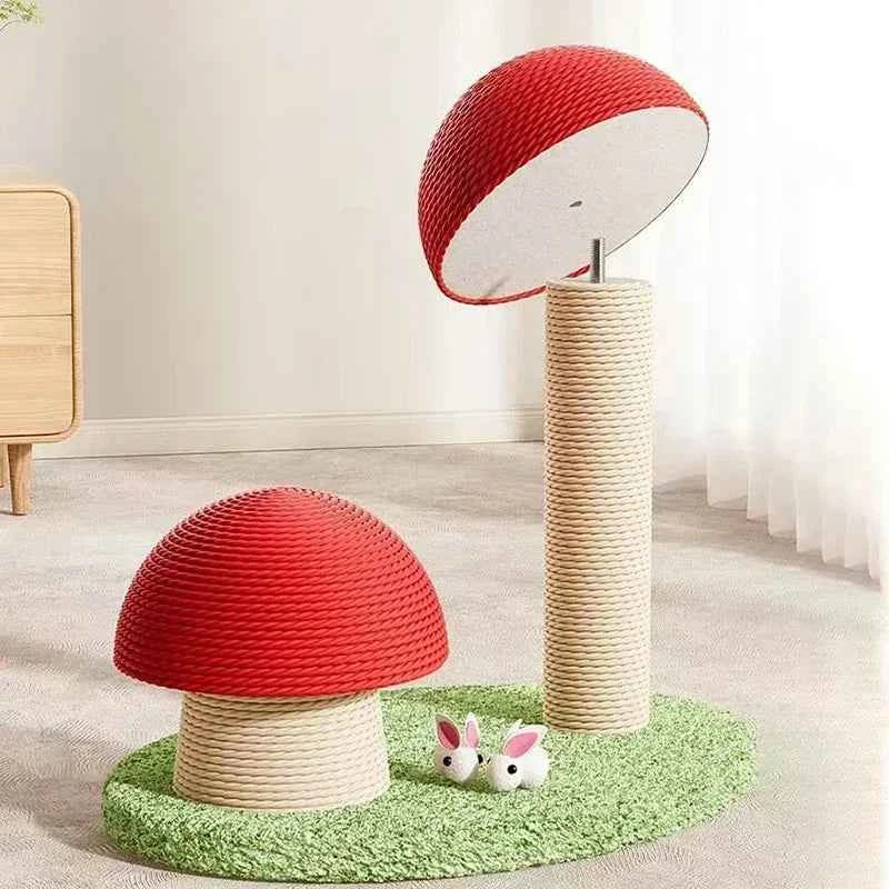 Red mushroom cat scratching post with green base and two pink rabbit toys at the base.