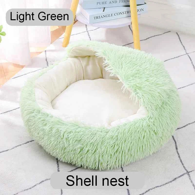 Light green shaggy shell-style donut pet bed with open round center and padded inner cushion