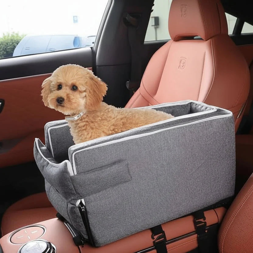 Grey car center console pet bed with raised sides and non-slip base, dog resting