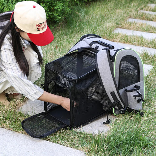 Gray and black expandable cat carrier backpack with mesh windows and adjustable shoulder straps
