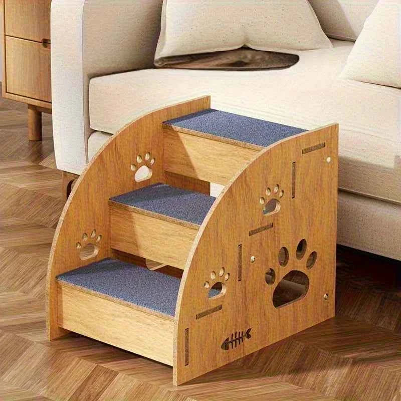 Dog ladder ramp next to sofa, light wood side panels with paw cutouts and blue steps