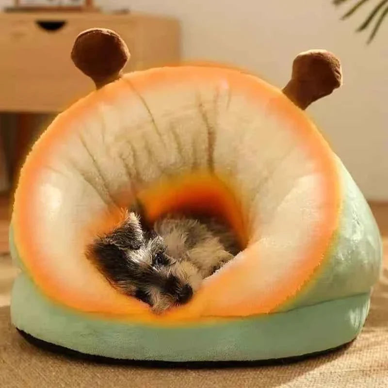 Green slippers-style dog bed with open center for a small dog to curl up