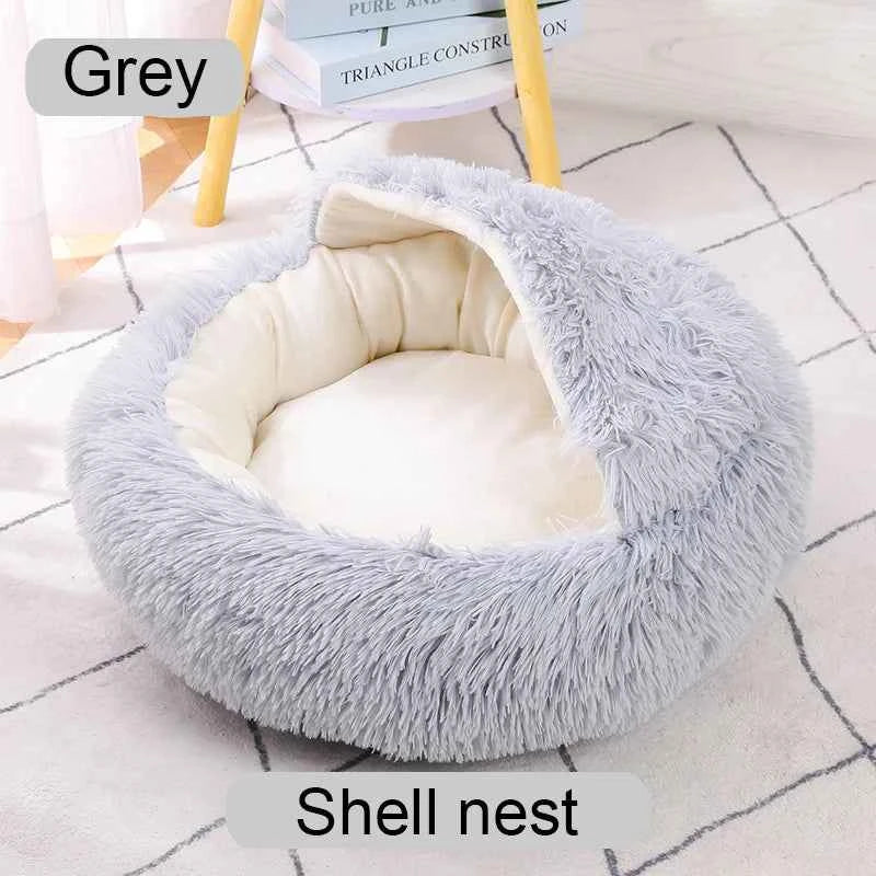 Grey shaggy shell-style donut pet bed with open round center and padded inner cushion