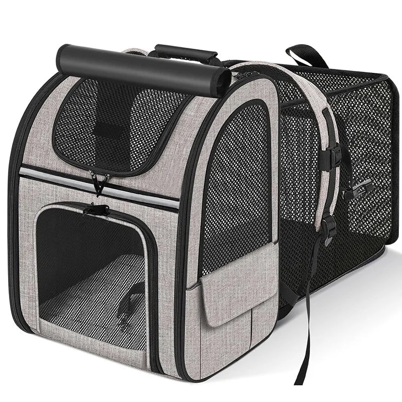 Gray expandable cat carrier backpack with mesh panels and padded shoulder straps