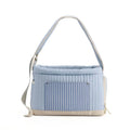 Light blue pet carrier sling bag with quilted hood and blue striped front panel