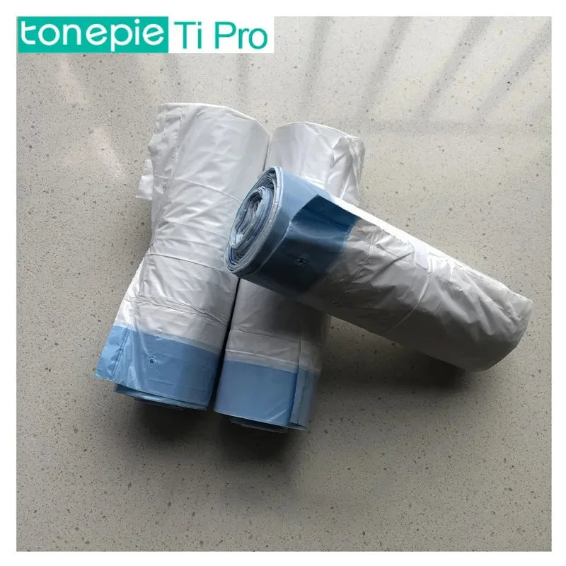 Roll of disposable liner bags in white and blue packaging