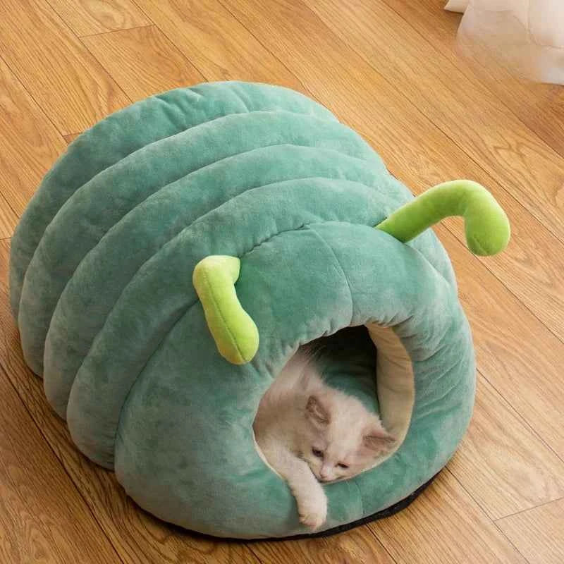 Green caterpillar pet bed with curved tunnel and lime antenna plush accents