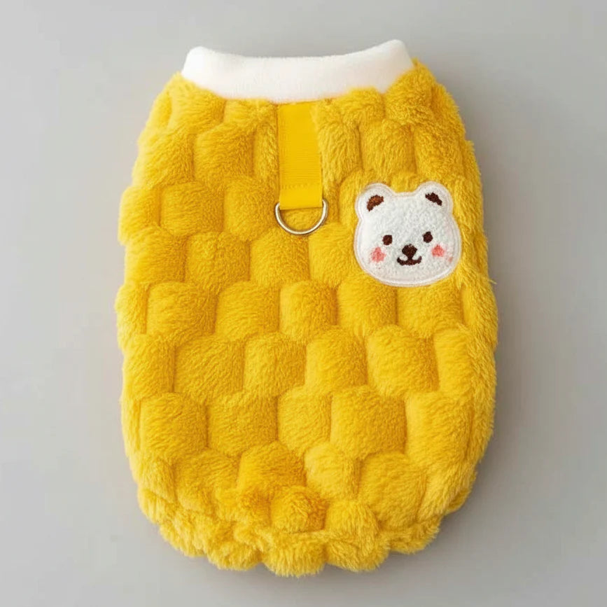 Solid yellow fluffy cat sweater vest with cream collar and bear patch front