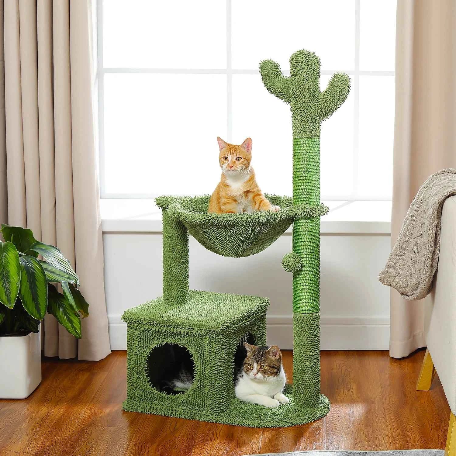 Green cactus cat tree with hammock bed and lower condo; cat on hammock