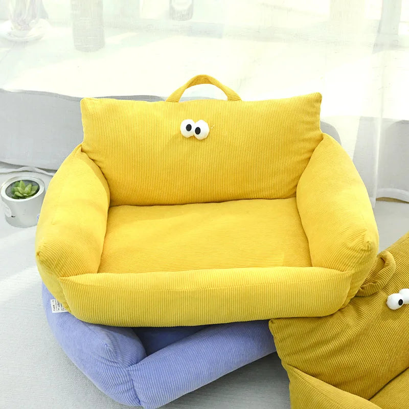Plush pet sofa bed in yellow corduroy with handle and cartoon face