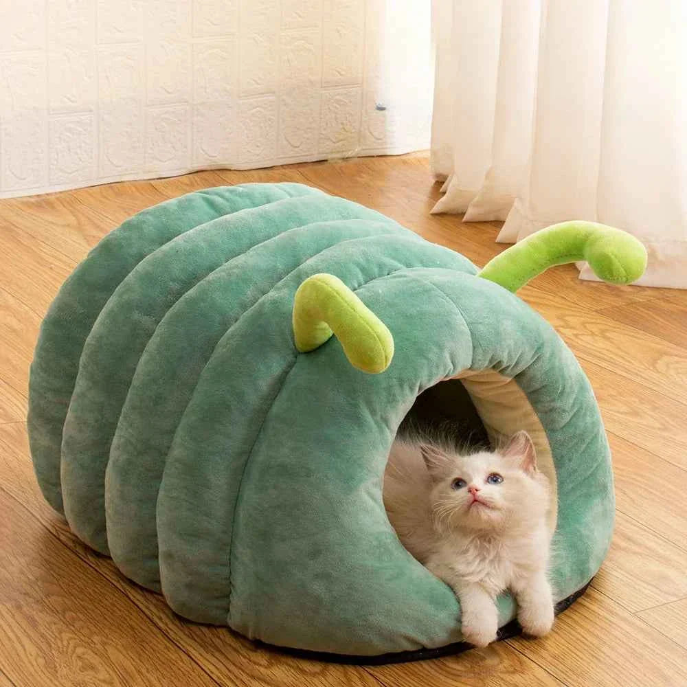 Green plush caterpillar pet bed tunnel with lime nose; cat resting inside