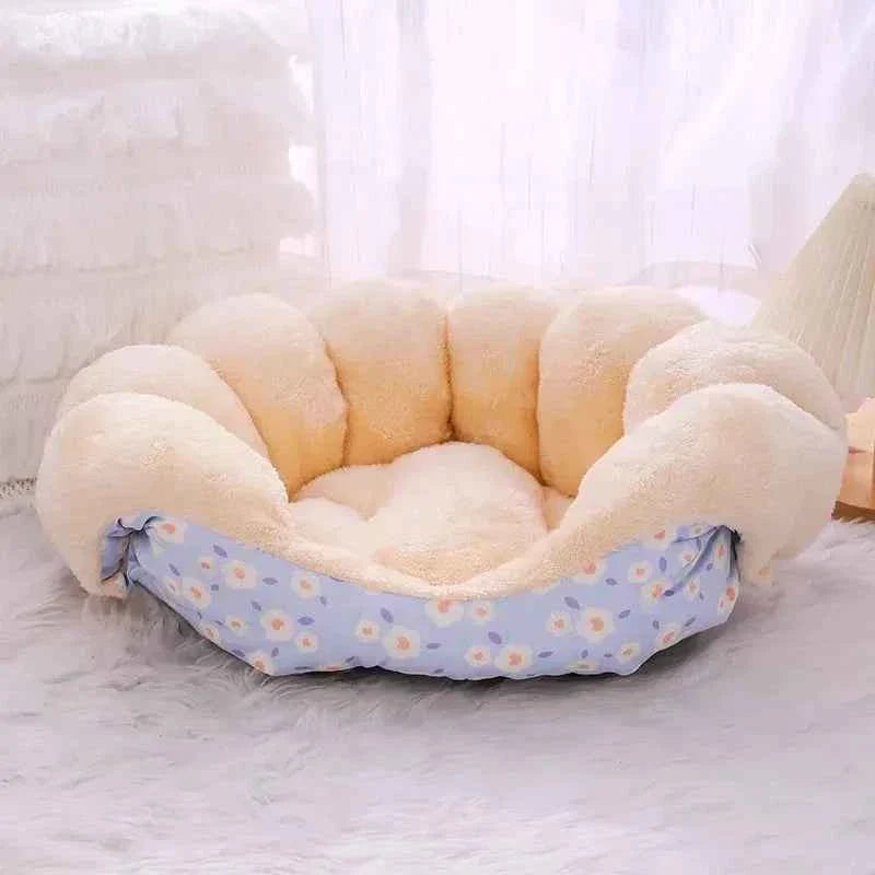 Blue patterned oval cat bed basket with thick cream bolster sides and open center