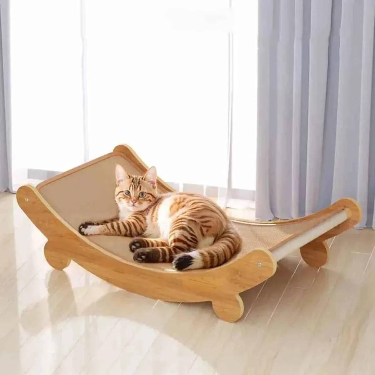 Curved wooden cat lounge with tan sisal scratching surface and side cutout handles