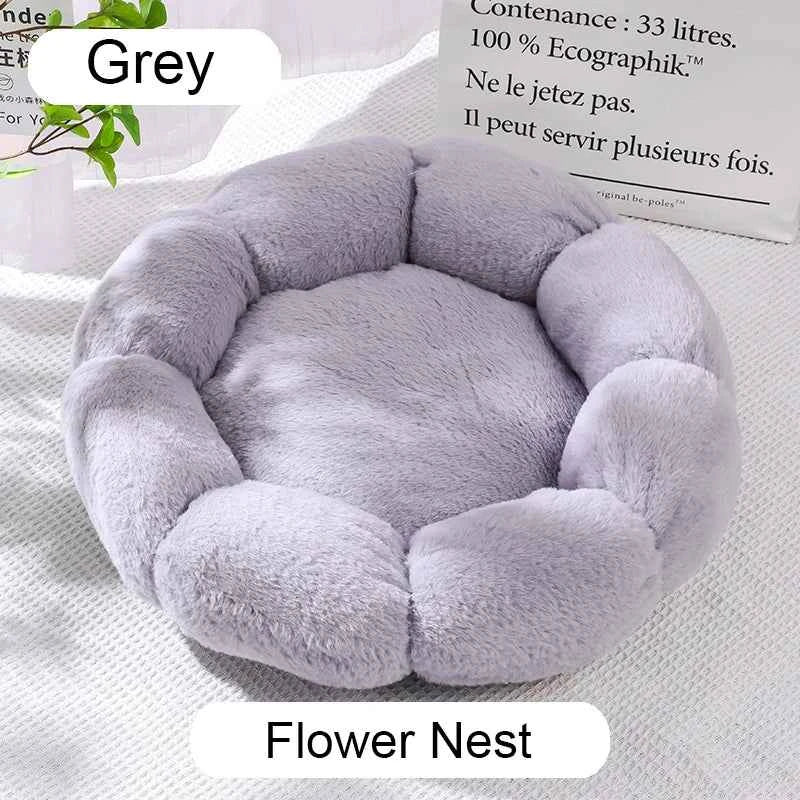 Grey plush donut pet bed with round nest; cushioned inner pad and raised side bolsters