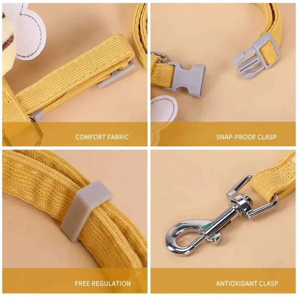 Close-up of yellow cat harness straps with snap clasp and metal leash hook