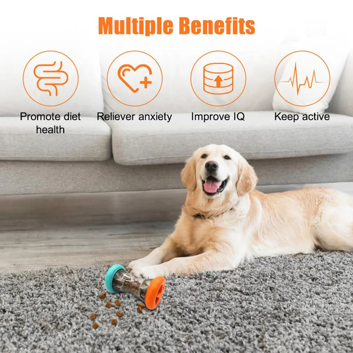 Teal and orange treat-dispensing dumbbell toy on the floor beside a dog