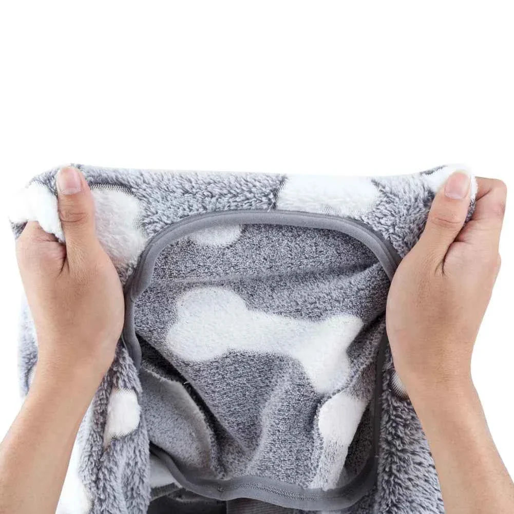Gray fleece dog jumpsuit pajamas close-up: striped leg openings and cozy belly panel