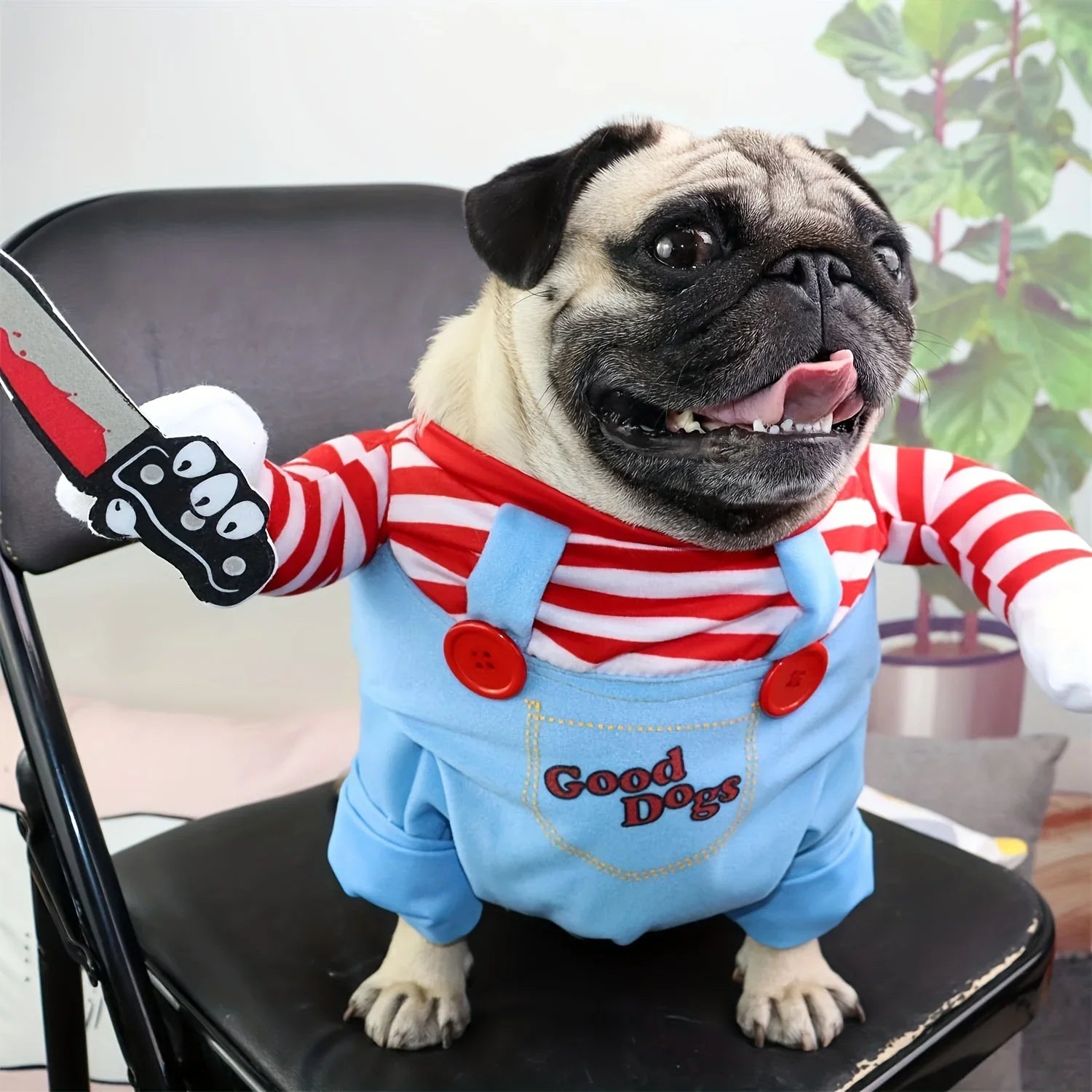Pet dog costume with blue overalls, red striped shirt sleeves, orange wig, toy knife prop.