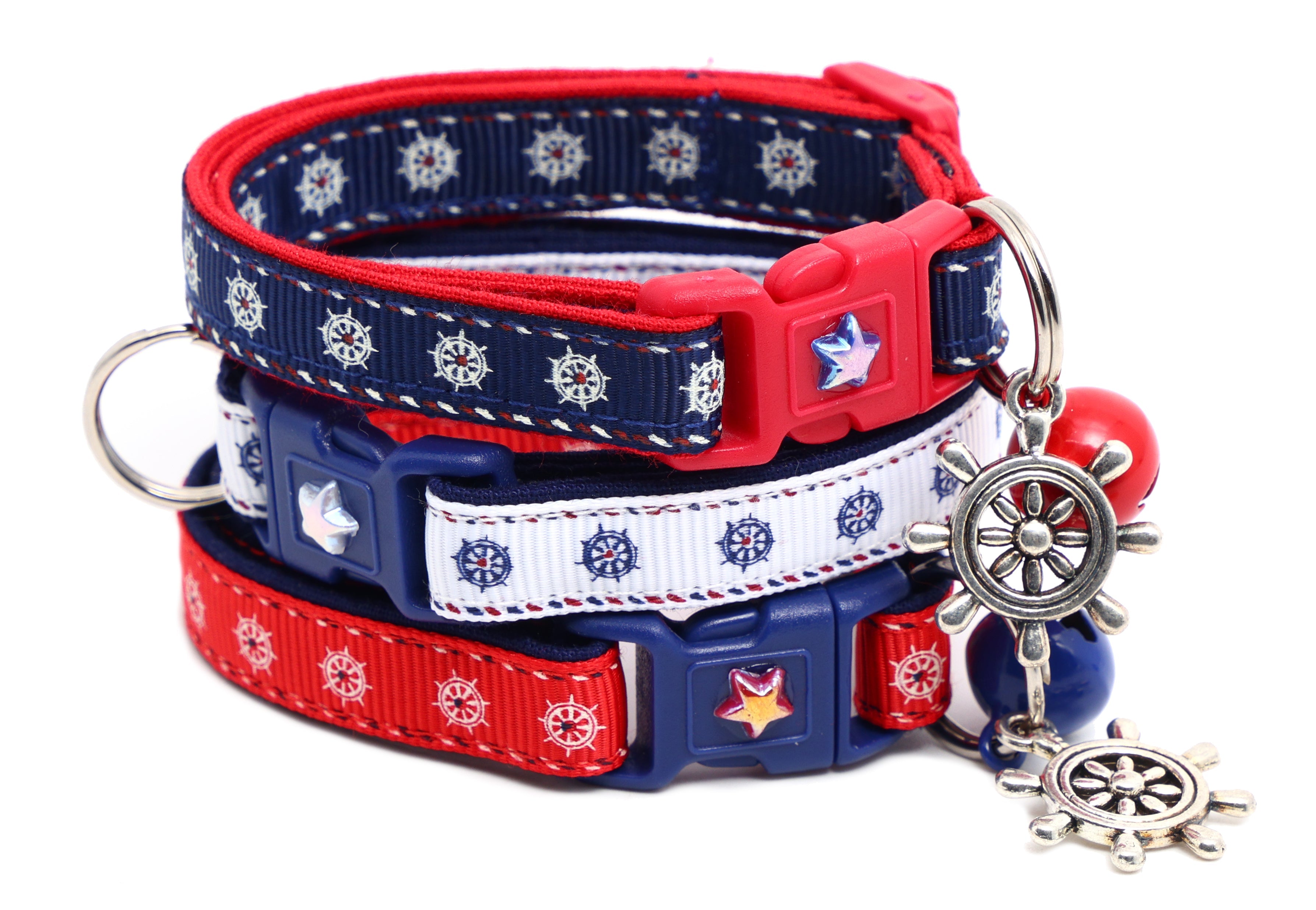 Layered red and navy cat breakaway collar with star details and ship wheel bell