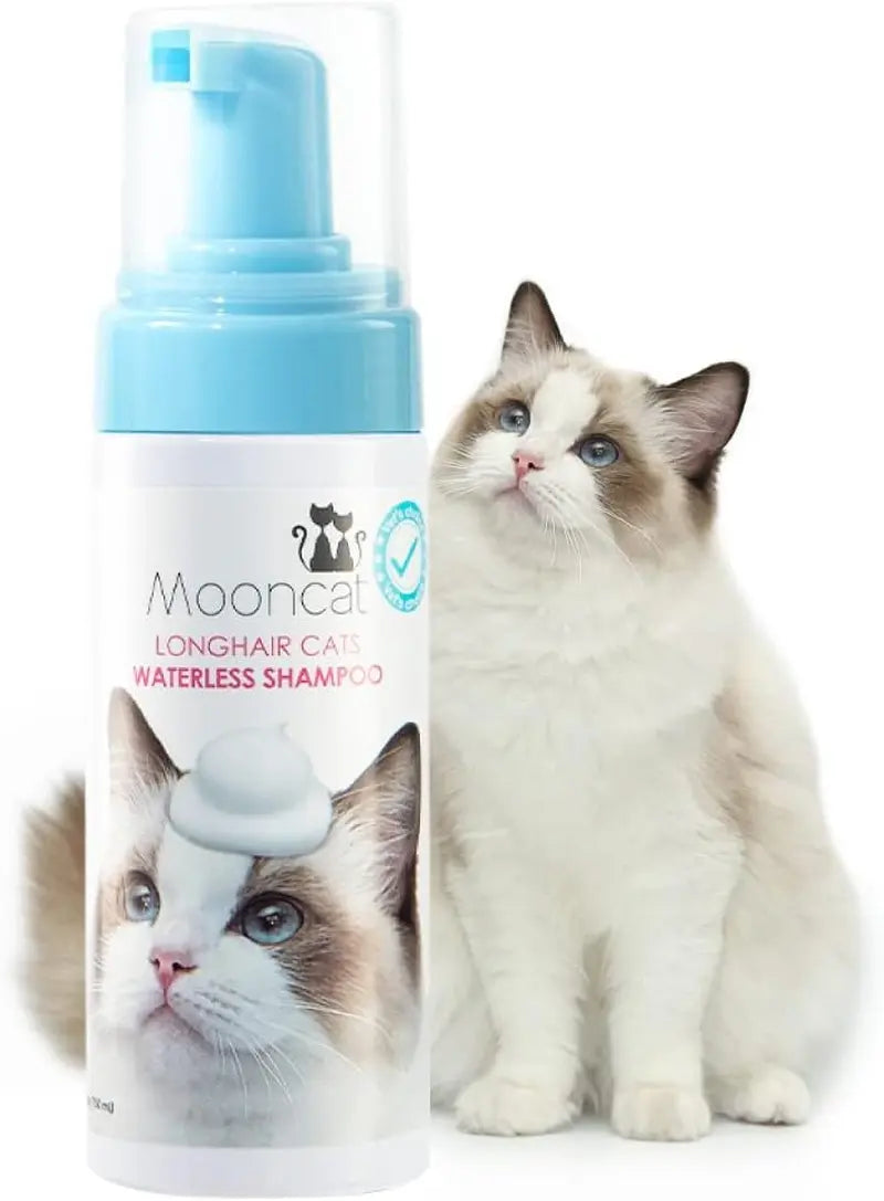Waterless cat shampoo foam bottle with pump and white longhair cat