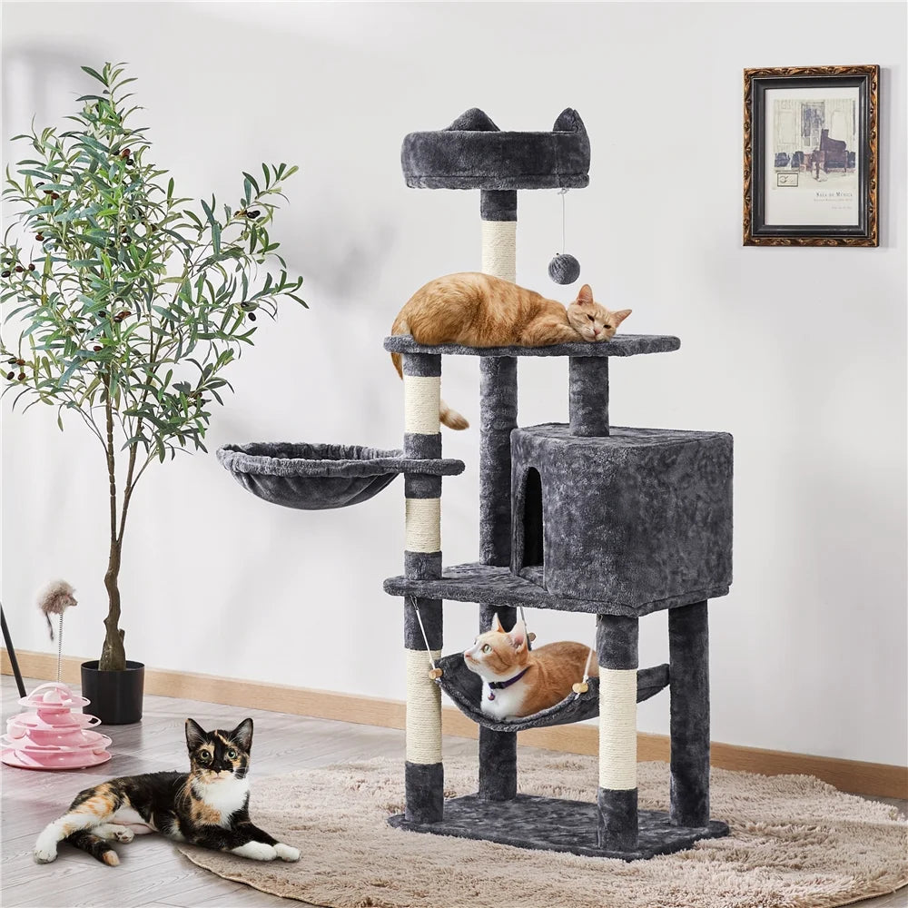 Dark gray cat tree tower with two cats and hammock, cubby, and top perch