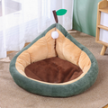 Dark green pear pet bed with beige bolster sides and brown plush base