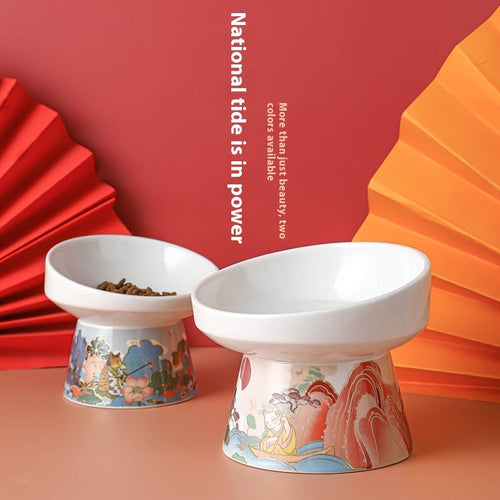 Ceramic elevated cat feeding bowls with white tops and illustrated patterned bases