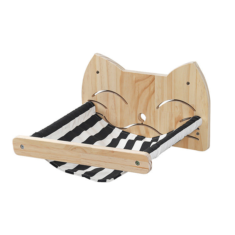 Wood cat scratching hammock with black-and-white striped resting bed and curved supports