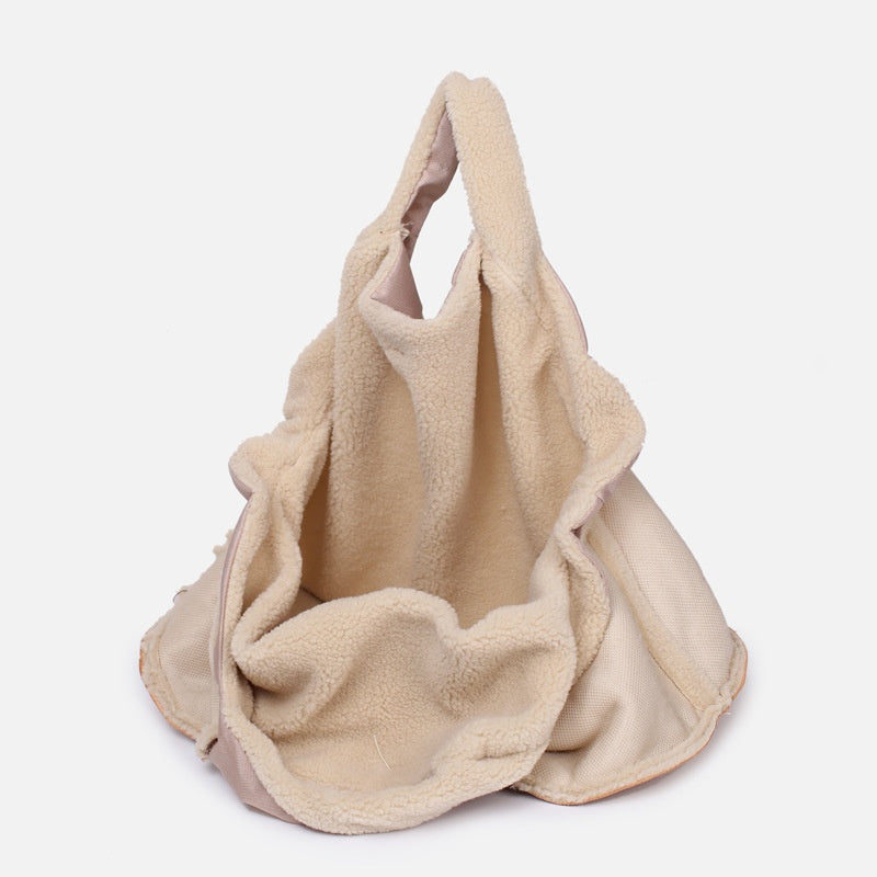 Beige pet carrier bag with plush interior and large side opening